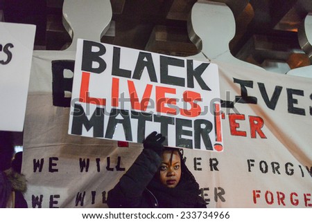 TORONTO, ONTARIO/CANADA - 25th Tuesday November  2014 : Toronto\'s Black Community holding banner,takes action in solidarity with Ferguson protesters in Toronto, Canada.