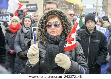 TORONTO, ONTARIO/CANADA -  11th Sunday January 2015 : Toronto people meets in a vigil to honor the victims of the Charlie Hebdo magazine shootings and to demonstrate against the terrorism.