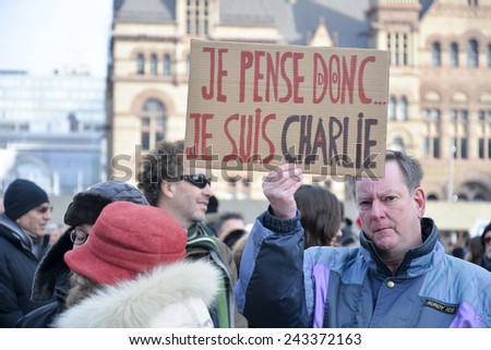 TORONTO, ONTARIO/CANADA -  11th Sunday January 2015 : Toronto people meets in a vigil to honor the victims of the Charlie Hebdo magazine shootings and to demonstrate against the terrorism.