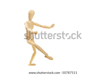 Artist's wooden mannequin in a dancing pose