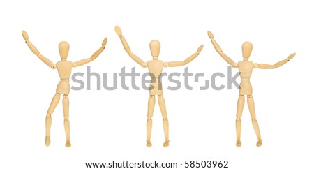 Three artist\'s mannequins in a row with their arms in the air