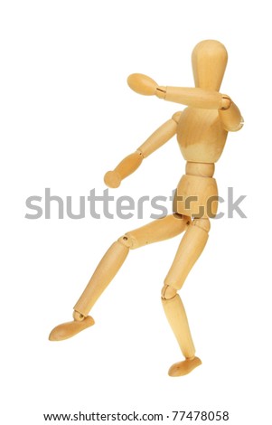 Artists wooden manikin in a martial arts fighting pose isolated against white