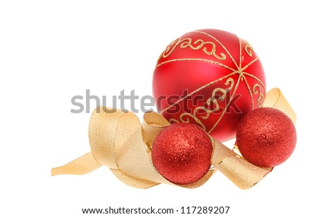 Christmas decoration of red and gold glitter baubles with a coiled gold ribbon isolated against white