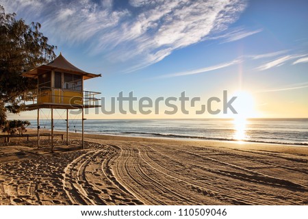 Lifeguard patrol tower on the beach at sunrise, Gold Coast, Australia
