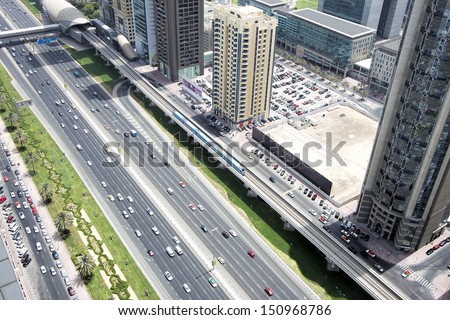 Dubai, Uae - August 13: View Of Sheikh Zayed Road. The Highway Runs Parallel To The Coastline To The Border With Abu Dhabi. It Is Home To Most Of Dubai Skyscrapers. August 13, 2013 Dubai, Uae
