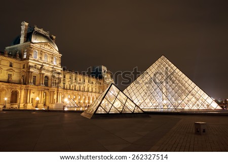 PARIS, FRANCE - JAN 03 : Louvre museum at twilight in winter on January 03 ,2013. Louvre museum is one of the world\'s largest museums with more than 8 million visitors each year.