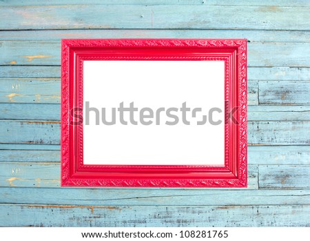 Red Vintage picture frame, wood plated, blue wood background, clipping path included