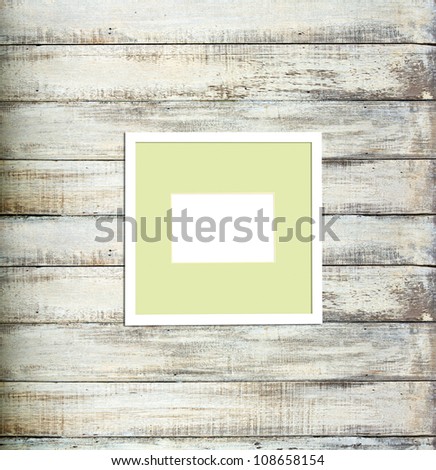 White Vintage picture frame, wood plated, old wood background, clipping path included