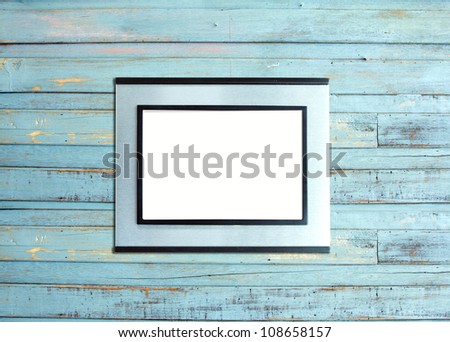 Silver Vintage picture frame, wood plated, blue wood background, clipping path included