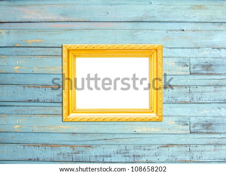 Gold Vintage picture frame, wood plated, blue wood background, clipping path included