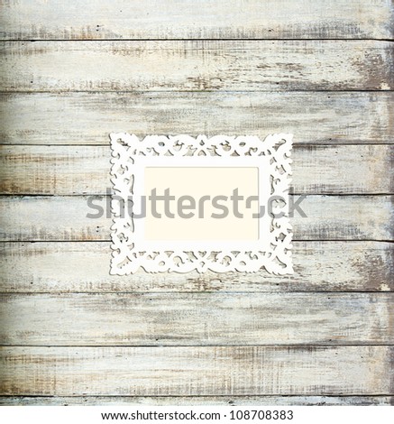 White Vintage picture frame, wood plated, old wood background, clipping path included