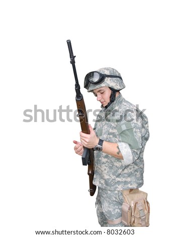 The isolated image with clipping path of the soldier in ACU reloading his rifle