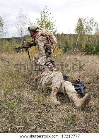 US Marines: soldier evacuating his wounded mate