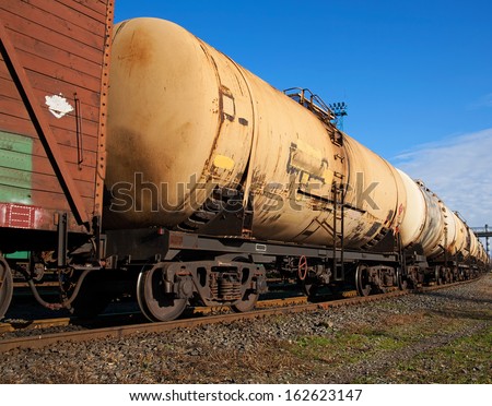 Cargo train with tank cars on the track