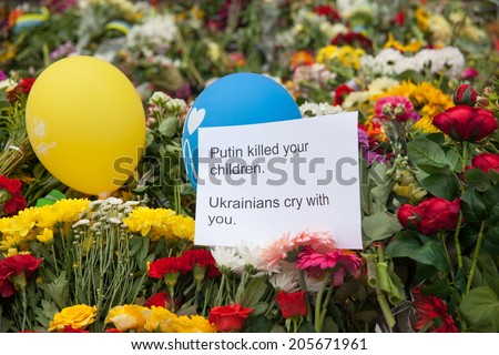 Kiev, Ukraine - July 18, 2014. People brought flowers and toys to the embassy of the Netherlands after the Malaysia Airlines B-777 (MH17) was shot down over Donetsk Region.