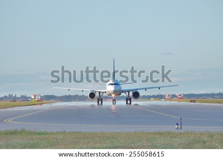 Jet taxiing along the runway in the airport