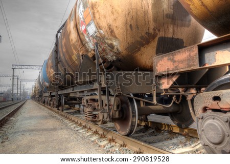 Train with oil railway cisterns on the track