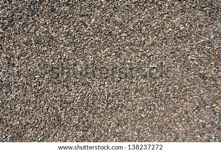 texture from gravel and sand on roof before grass
