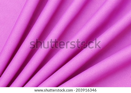 It is a beautiful smooth purple fabric.