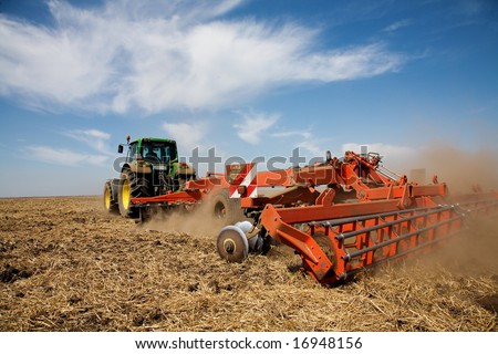 Tractor at work on farm, general rural scene