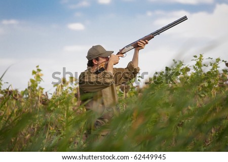 Young male hunter aiming the hunt during a hunting party