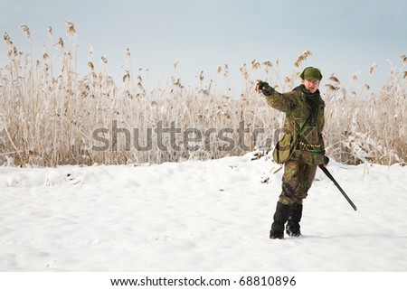 Hunter giving directions to the other hunters. General winter hunting scene during the open season