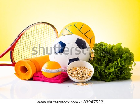 Fitness food and sport equipment, healthy food on yellow background