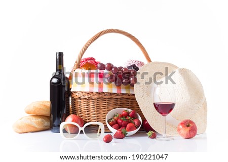 picnic basket full of food and wine