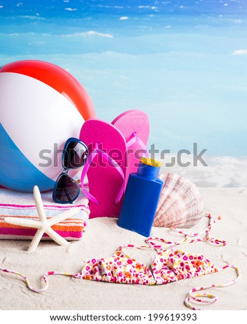 Women's swimsuit, flip-flops, beach ball, sunblock lotion, starfish, sunglasses