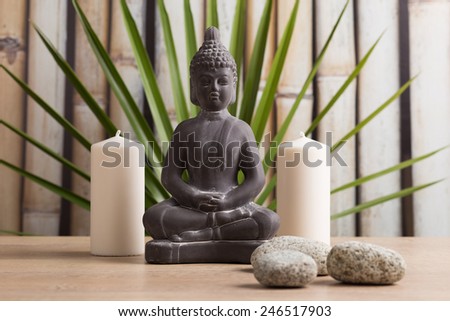 Buddha statue, white candles