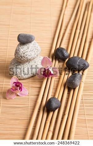 Zen stones with bamboo and orchid flowers
