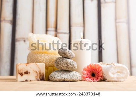 Wellness, spa - white candle, zen stone, towel, sponge, sponge