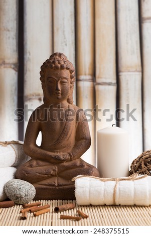 Relaxation concept with Buddha statue and white candle