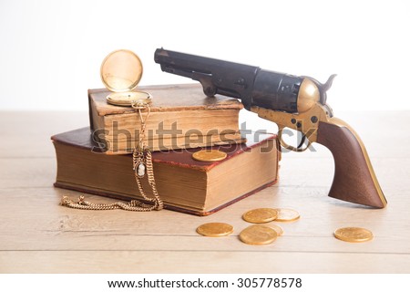 Revolver, golden watch and old books