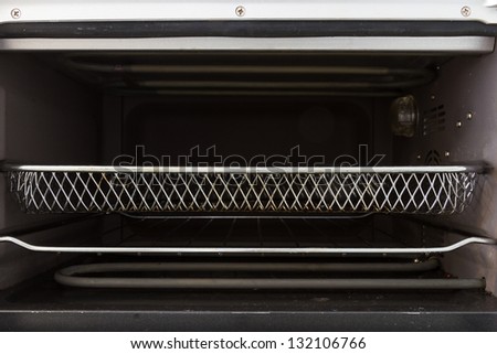 Empty tray inside oven front view