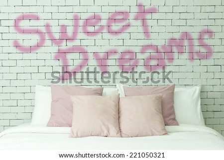 Sweet dreams concept on bricks wall background