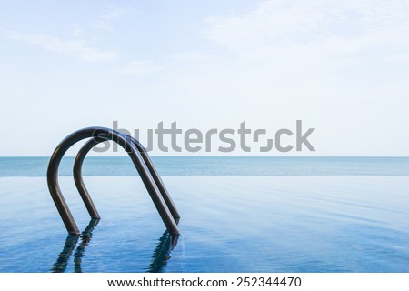 Sea view of infinity swimming pool with sky