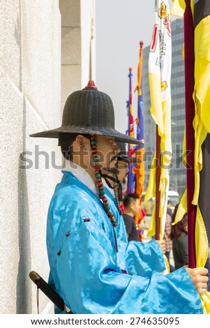Korean soldier costume vintage around Gyeongbokgung palace  Seoul, South Korea - April 11, 2015: Koreans in Traditional Costumes on duty of the Royal Guard Ceremony at Gyeongbokgung Palace