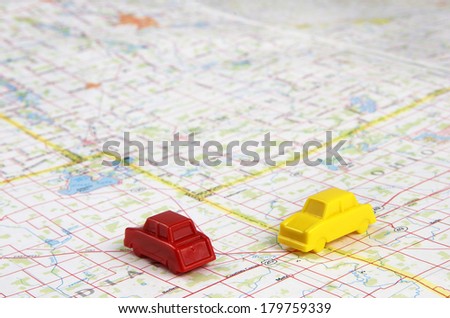 Plastic Toy Cars On Map