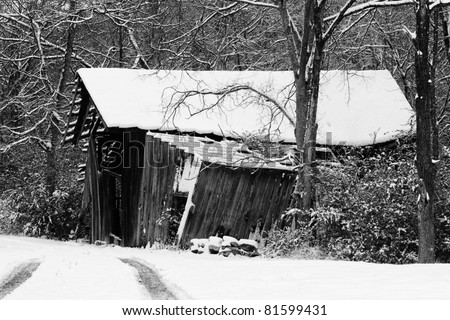 Old barn in rural  Tennessee  covered in snow