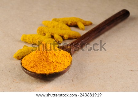 turmeric powder with turmeric sticks