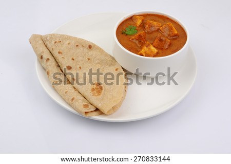 Paneer Tikka Masala, Curry, Indian food, India,Folded homemade wheat chapati (Indian bread) served with delicious Indian paneer butter masala
