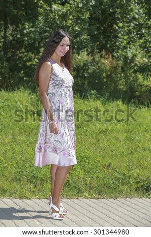 Intelligent woman against the backdrop of nature rests