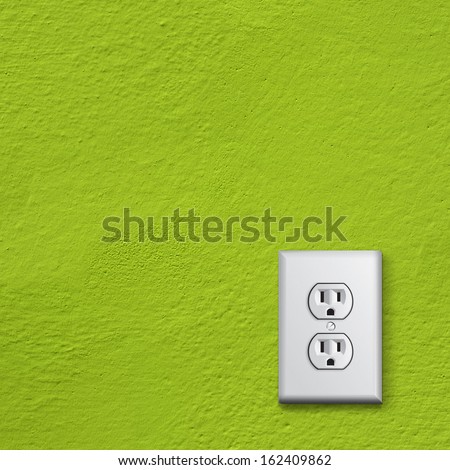 simple white electric usa socket on green wall