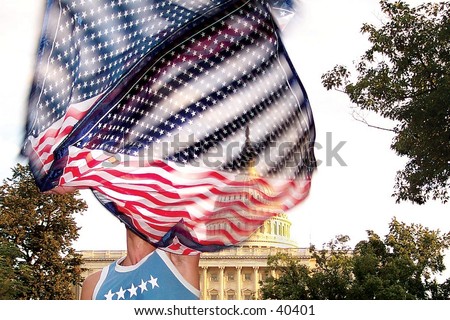 A raver waves a flag during a protest in front of the United States Capitol Building in Washington, D.C.