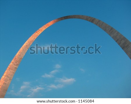 The Gateway Arch with reflected sunlight around time of sunset. St. Louis, MO.