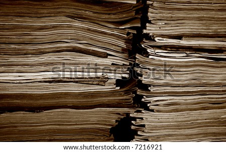 Stack of old magazines in sepia tones