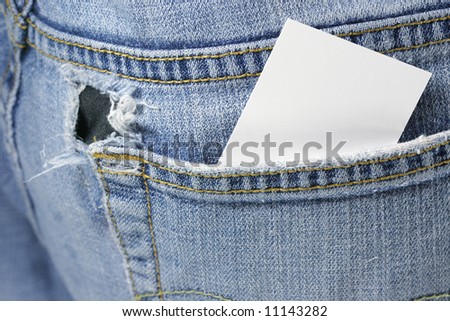 Blank card in back pocket of torn jeans