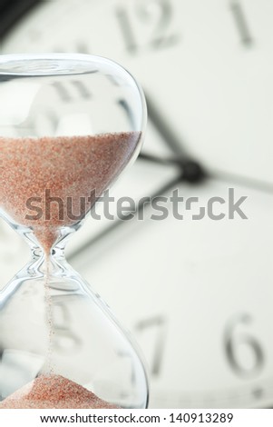 Concept of time - Hourglass and clock