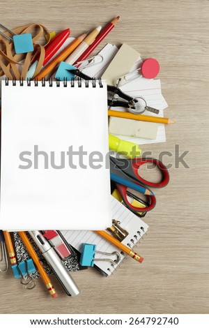Blank paper on lots of office supplies
